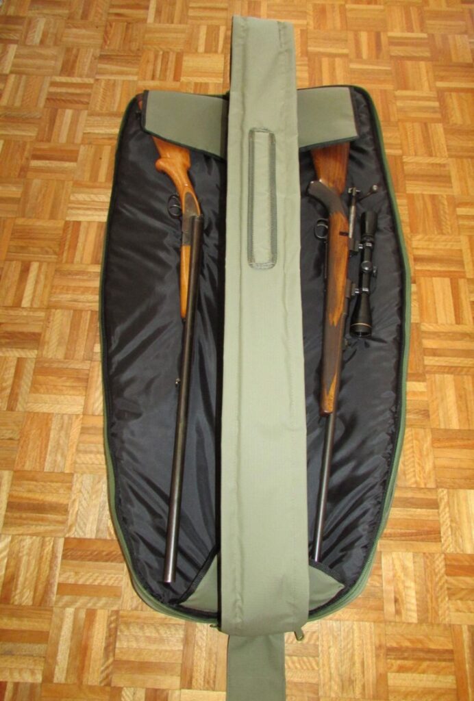 Gun bag open with two scoped rifles strapped in place